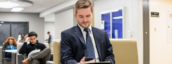 A male student on his cell